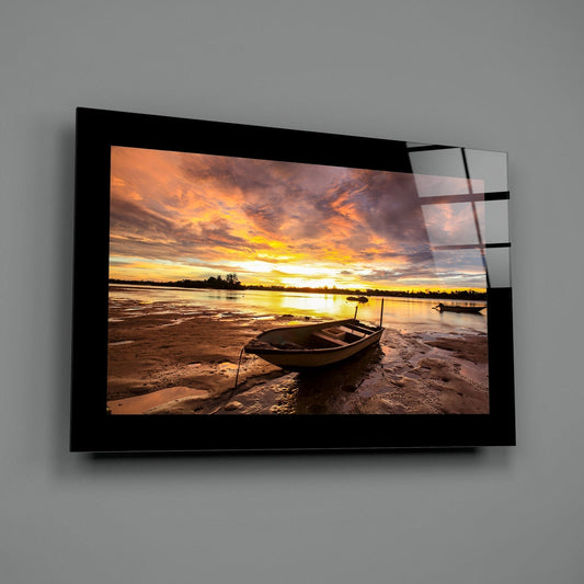 Fiery Dusk Stranded Boat Glass Wall Art