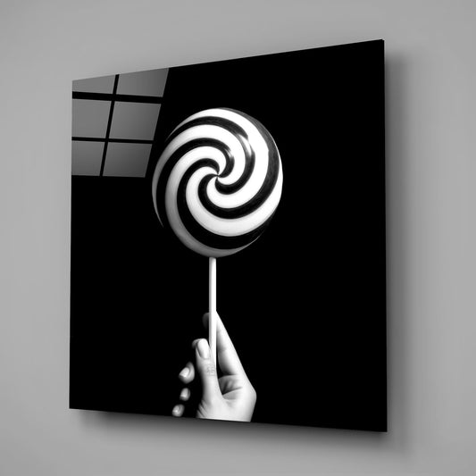 Hand Holding Spiral Lollipop Glass Wall Art