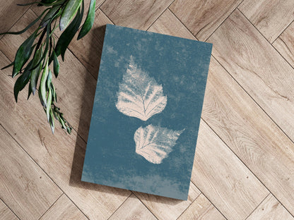 Two Cream Leaf Prints on Blue Grunge Aluminum Print