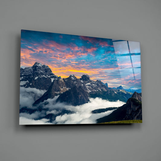 Fiery Sunset Clouds Over Rocky Peaks Glass Wall Art